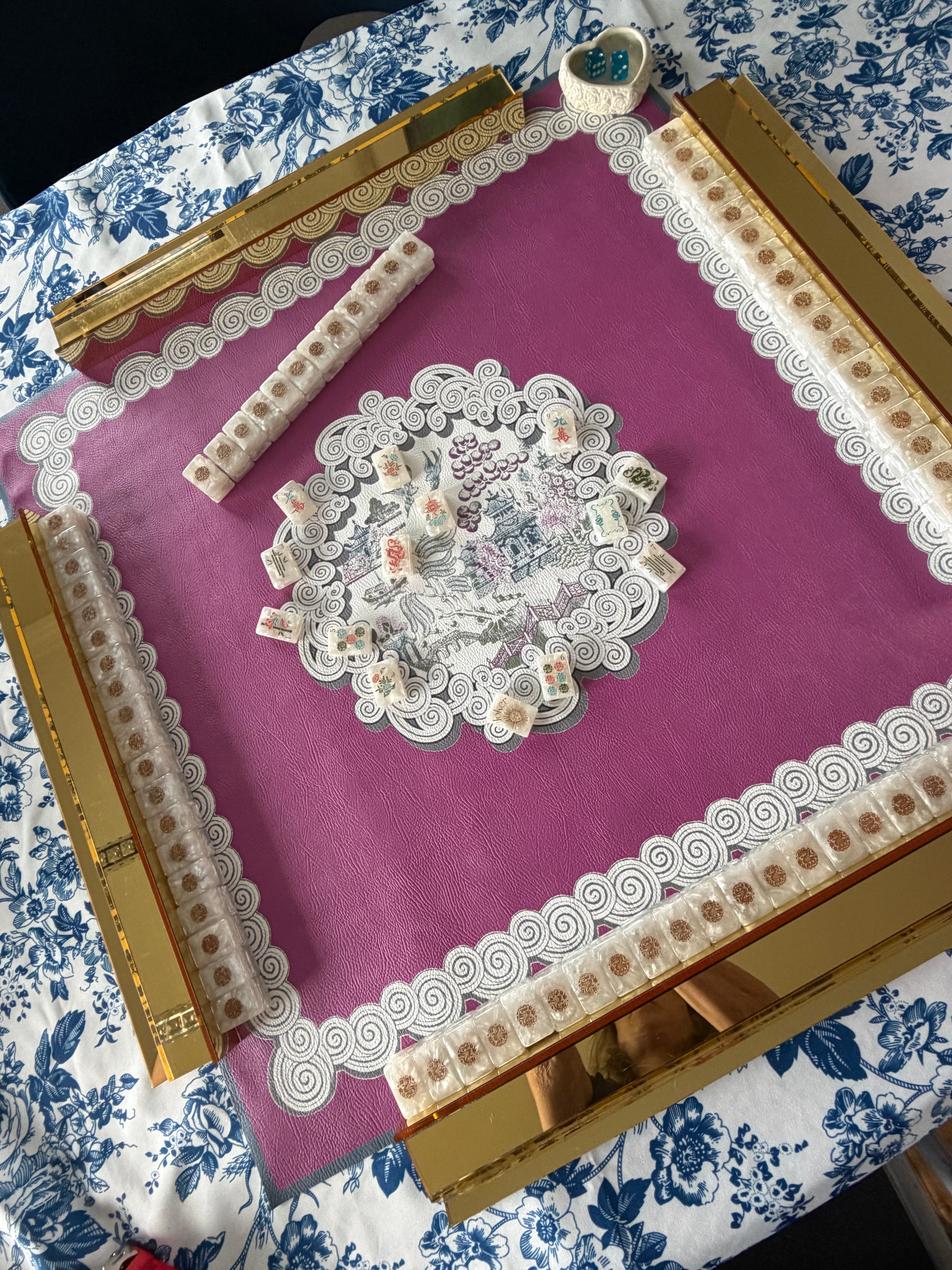 Pink and gold mahjong full set-up rental with mat, tiles, racks, dice, and shuffler