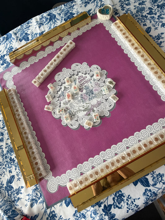 Pink and gold mahjong full set-up rental with mat, tiles, racks, dice, and shuffler